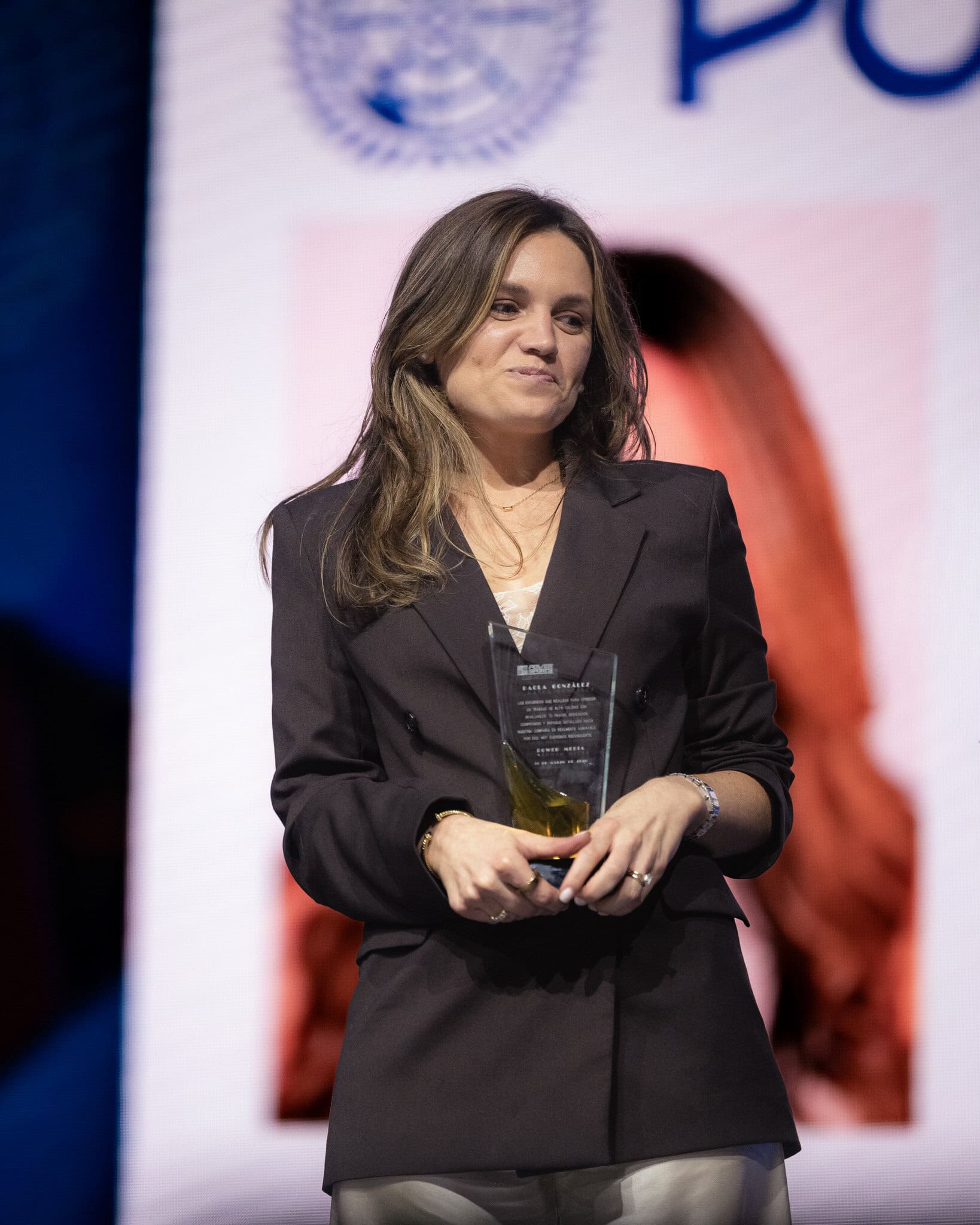 Paola Llonch receiving the Key to Success award at Power Brands business event in Puerto Rico
